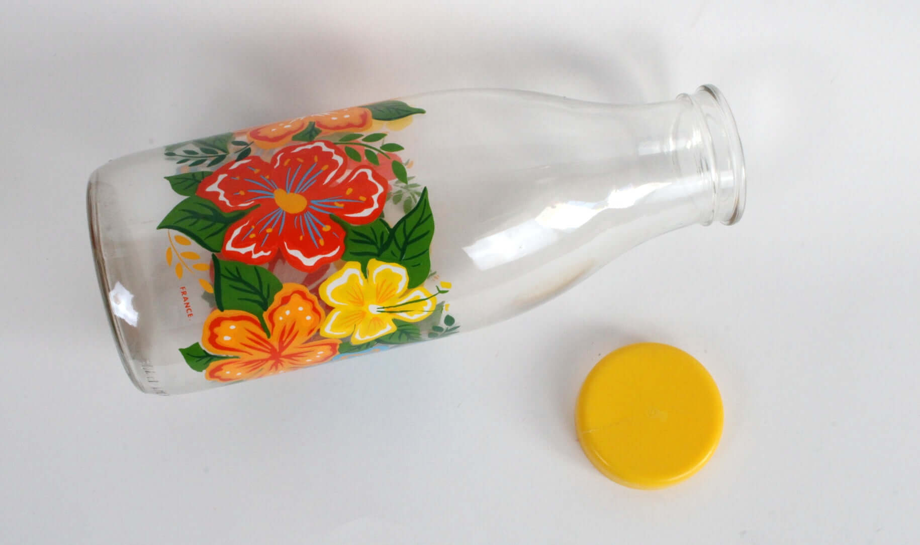 Vintage Bouteille en verre décor fleurs d'hibiscus