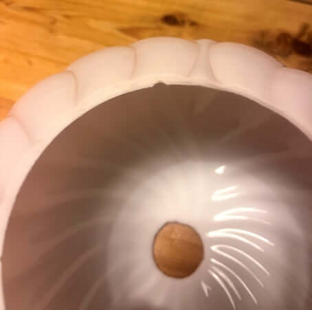 Globes anciens en verre rose poudré