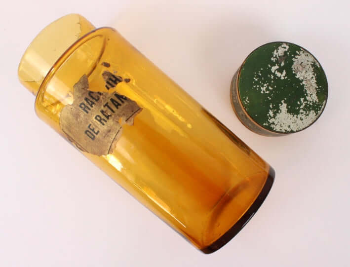 Ancien pot d'apothicaire en verre ambré